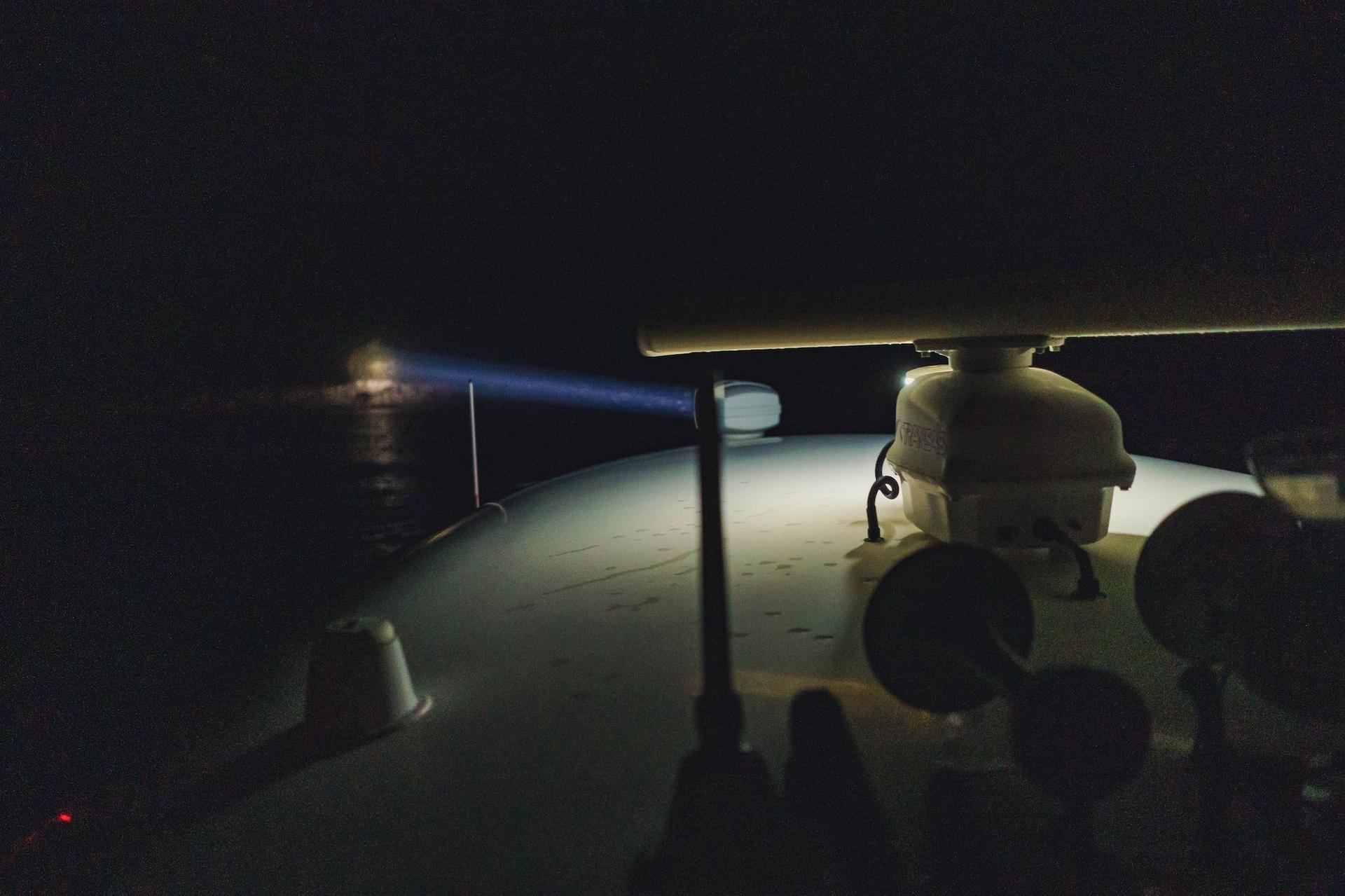 The spotlights of the patrol boats, pointed towards the shores, in search of illegal migrants. Photo: Ioana Epure