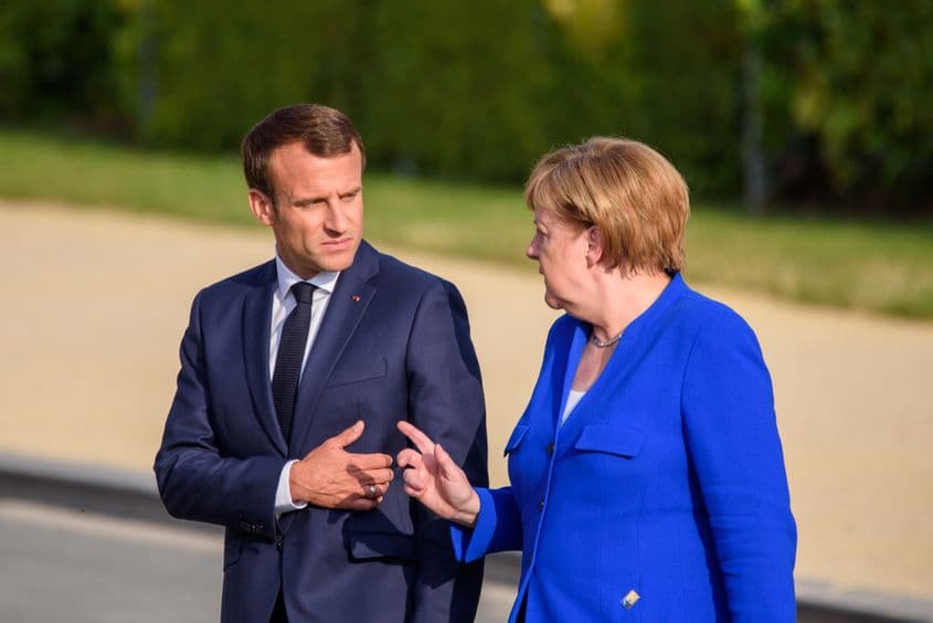 Emmanuel Macron și Angela Merkel, la summit-ul NATO din Bruxelles, în 2018 © Gints Ivuskans | Dreamstime.com