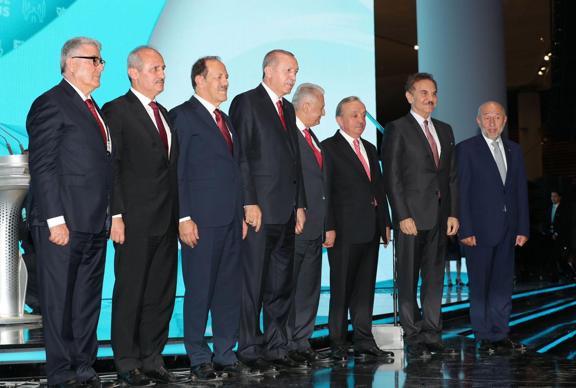 Turkish President Recep Tayyip Erdoğan with the heads of Turkey's largest construction companies at the inauguration of Istanbul International Airport. They include MAPA President Mehmet Nafız Günal (2nd from right), LİMAK President Nihat Özdemir (right), CENGİZ President İnșaat Mehmet Cengiz (3rd right), KALYON President Cemal Kalyoncu (3rd left) and KOLİN President Naci Koloğlu (left). Photo credit: Cem Öksüz - Anadolu Agency