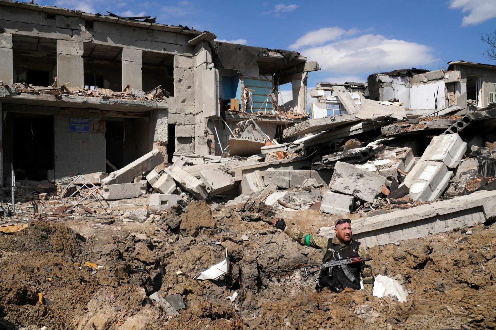 Yuri, in front of a destroyed school.  Photo: Raul Ștef